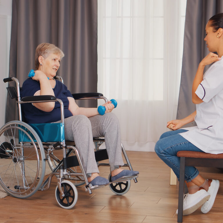 Old lady in wheelchair doing physical rehabilitation with nurse. Training, sport, recovery and lifting, old person retirement home, healthcare nursing, health support, social assistance, doctor and home service